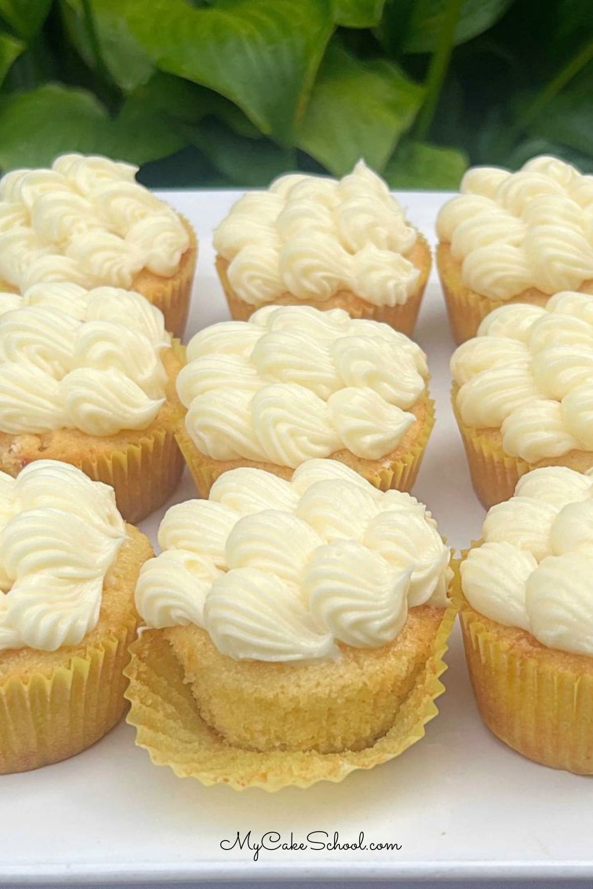 Pineapple Cupcakes on a cake plate.