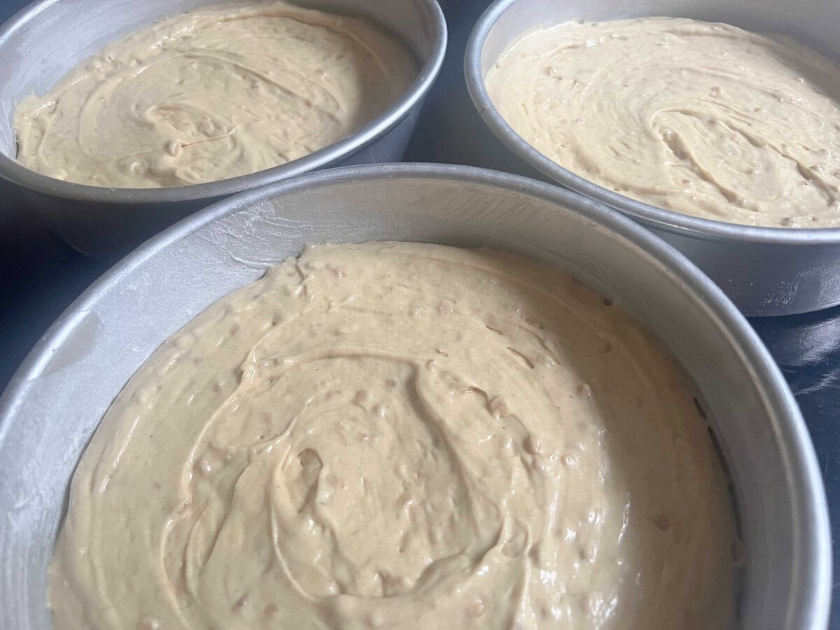 Pans filled with cake batter.