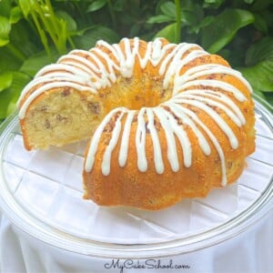 Coconut Pecan Cake, sliced, on a cake pedestal.