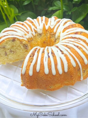 Coconut Pecan Cake, sliced, on a cake pedestal.