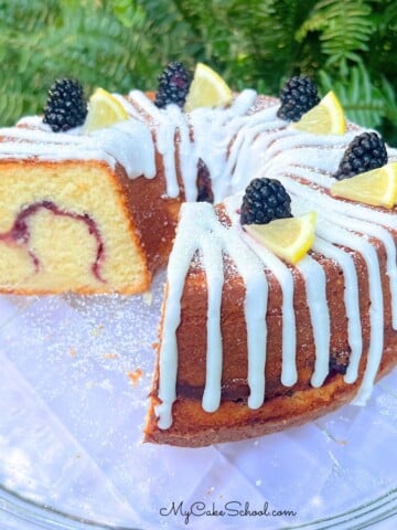 Lemon Blackberry Pound Cake on a cake plate.