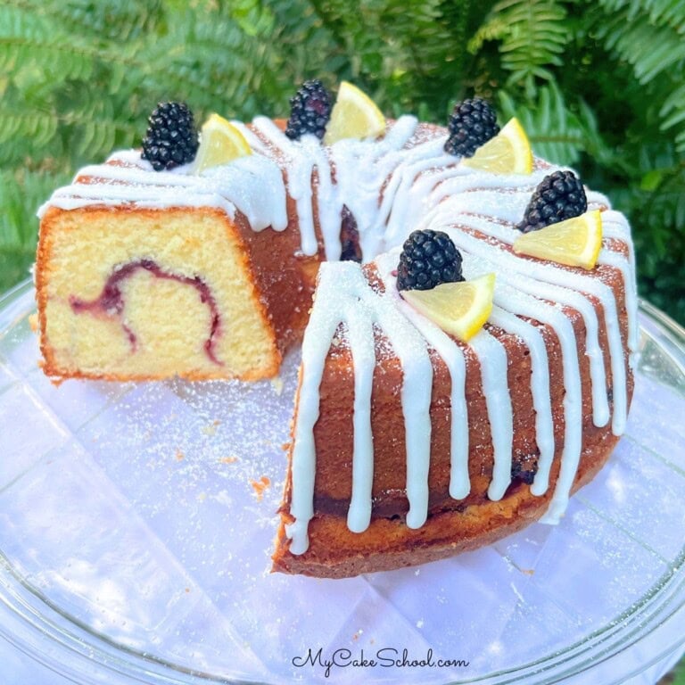 Lemon Blackberry Pound Cake on a cake plate.