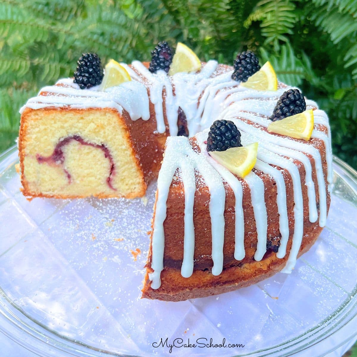 Lemon Blackberry Pound Cake on a cake plate.