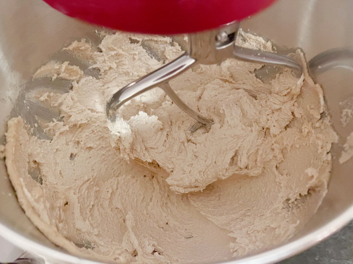 Butter and sugar in mixing bowl.