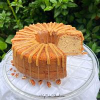 Pecan Spice Pound Cake, sliced, on a cake plate.