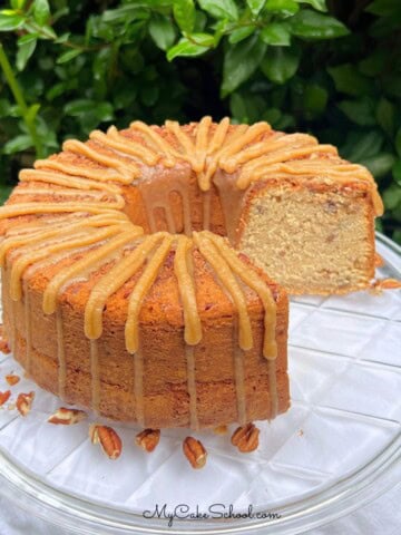 Pecan Spice Pound Cake, sliced, on a cake plate.