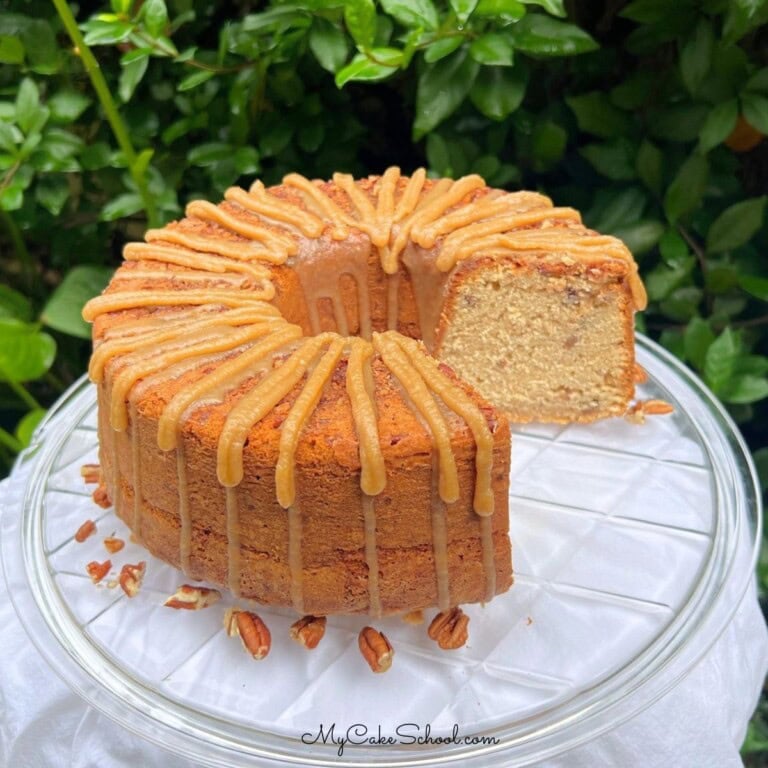 Pecan Spice Pound Cake, sliced, on a cake plate.