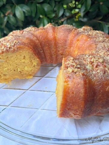 Apple Rum Cake on a cake plate.