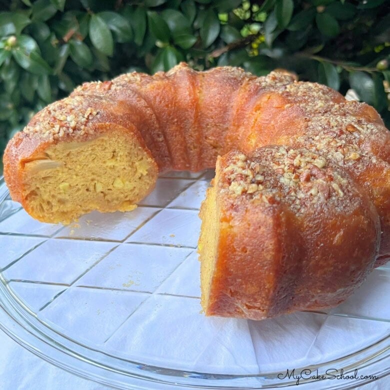 Apple Rum Cake on a cake plate.