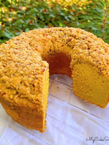 Pumpkin Pound Cake, sliced, on a cake plate.