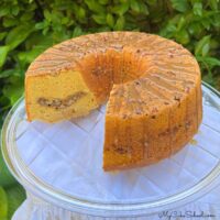 Decadent Sweet Potato Pecan Pound Cake on a cake plate.