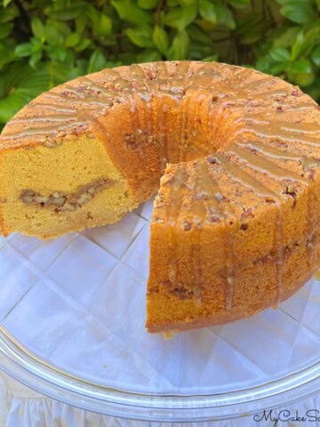 Decadent Sweet Potato Pecan Pound Cake on a cake plate.