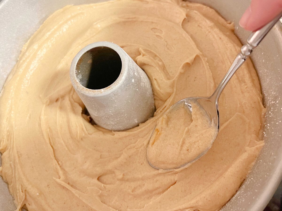 Smoothing batter into cake pan.