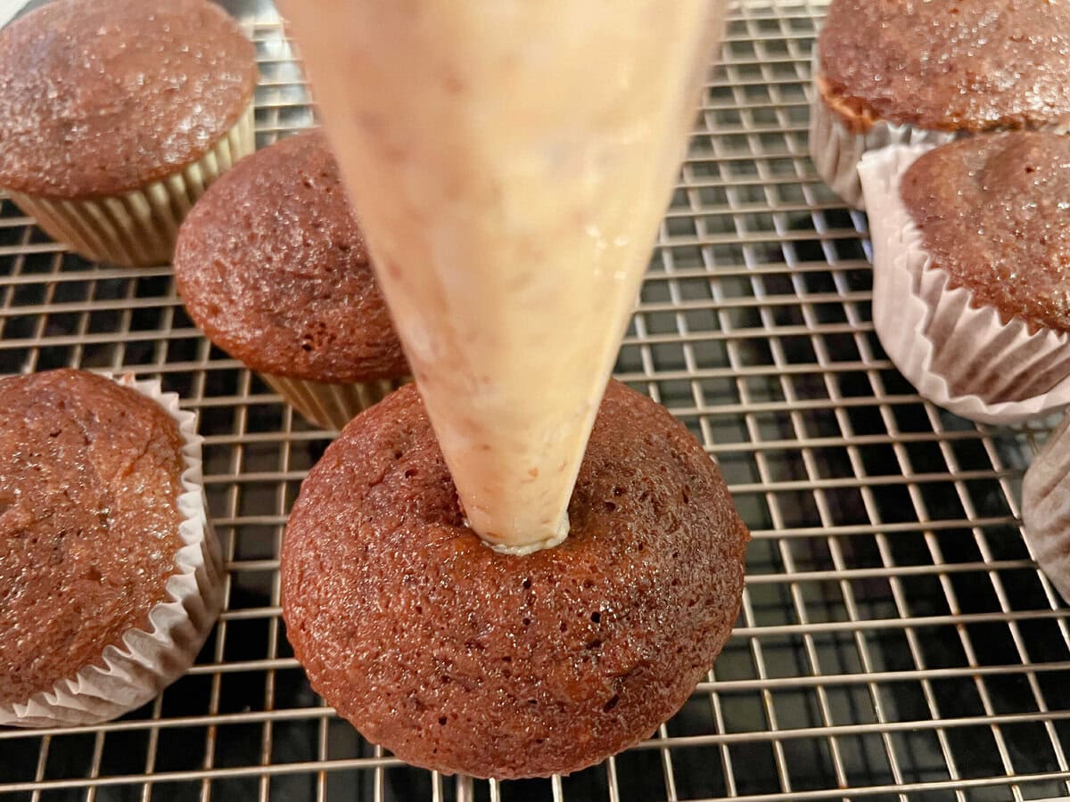 Filling the cupcakes.