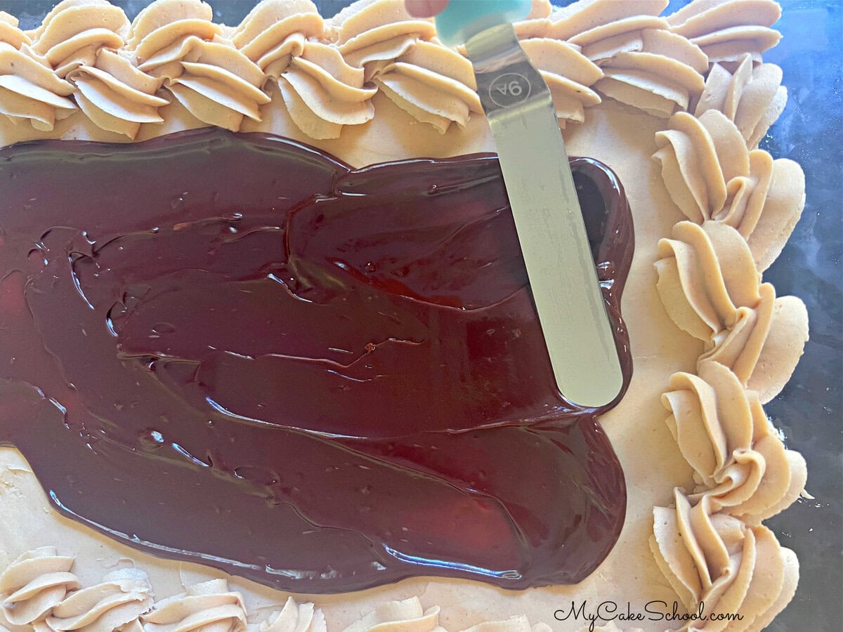 Chocolate sheet cake, frosted with peanut butter buttercream, sliced. 