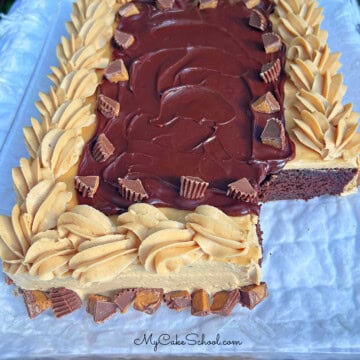 Chocolate Peanut Butter Sheet Cake, sliced, on a cake plate.