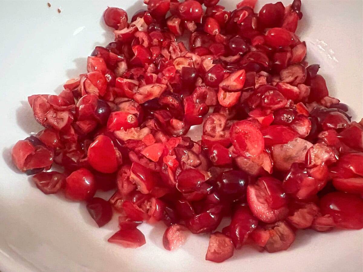sliced cranberries in a bowl.