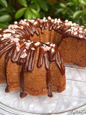 Chocolate Peppermint Cake, sliced, on a pedestal.