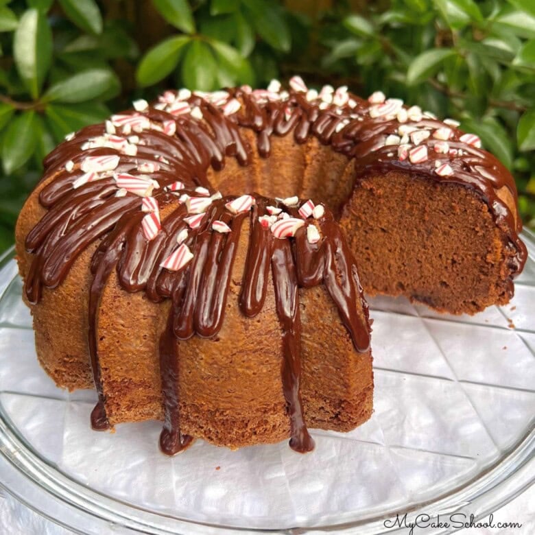 Chocolate Peppermint Cake, sliced, on a pedestal.