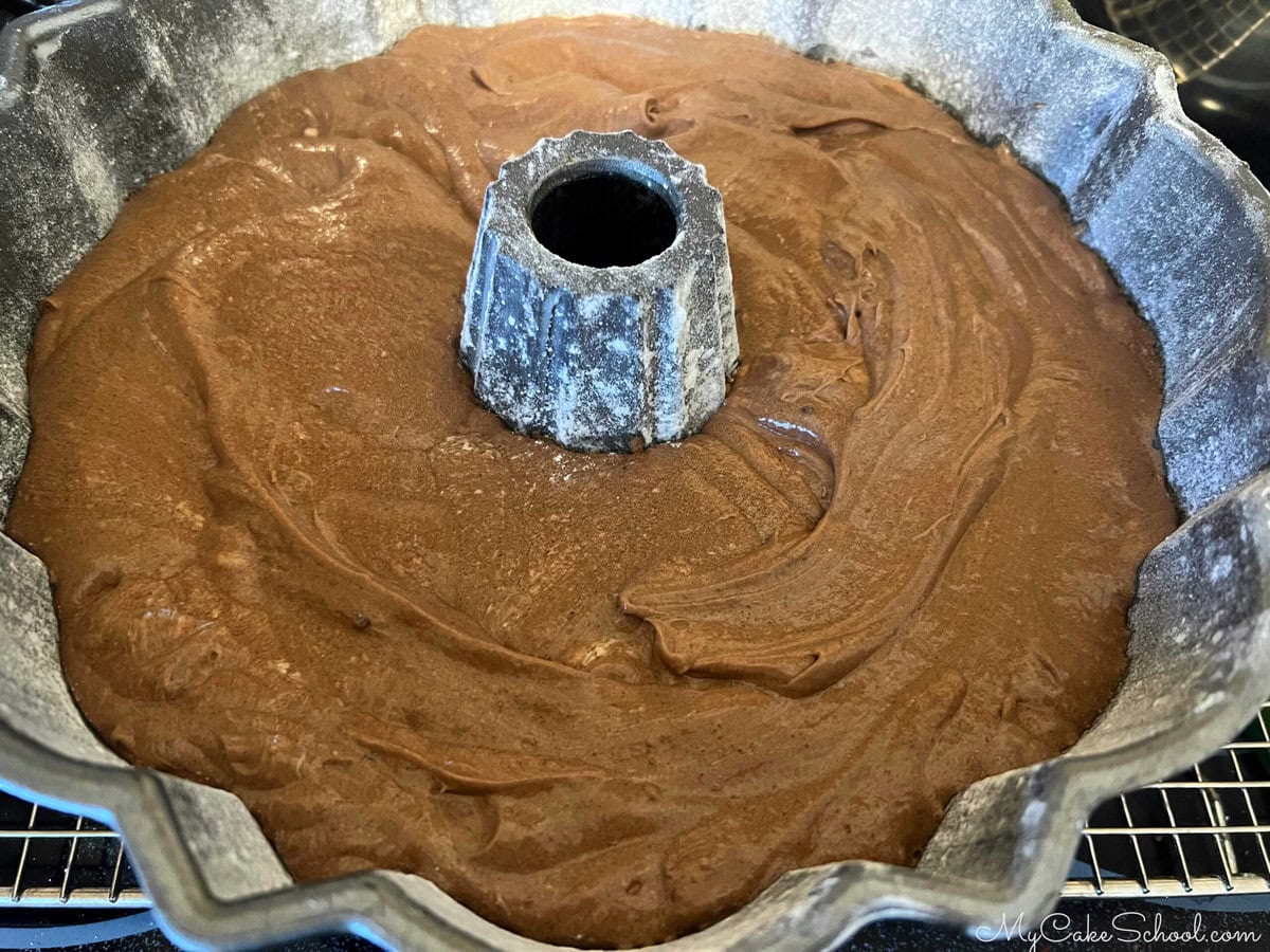 Chocolate batter in prepared bundt pan.