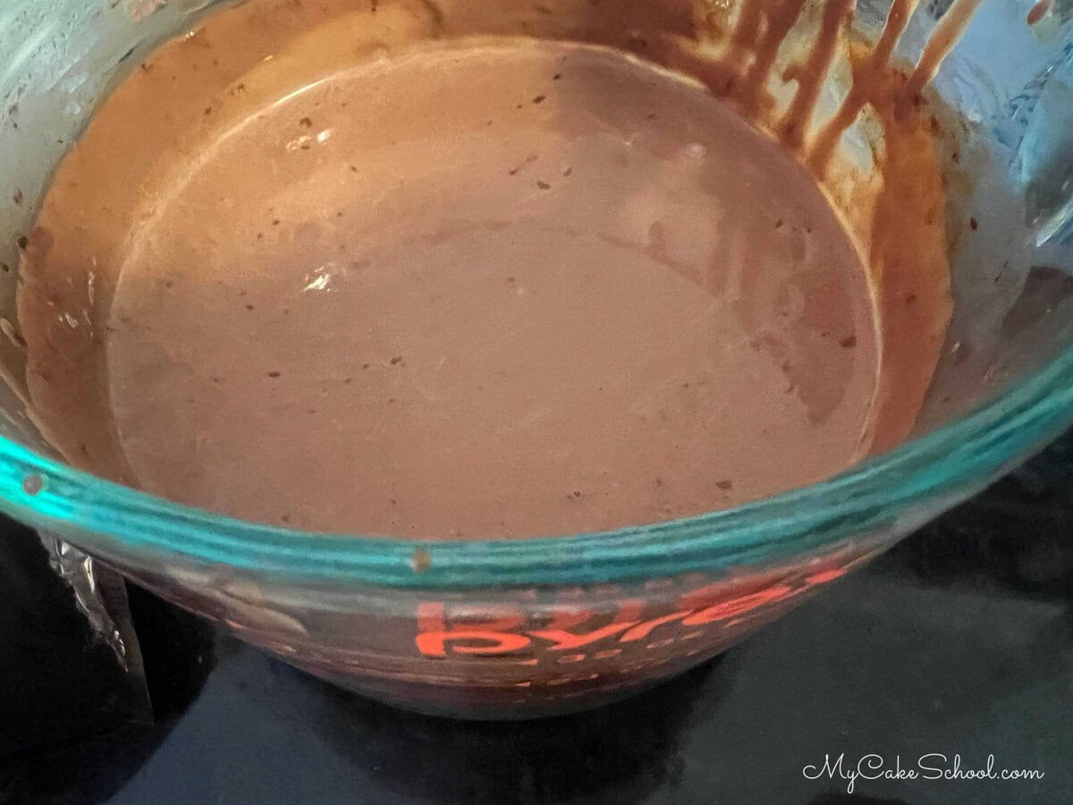 Cocoa powder combined with heavy cream.