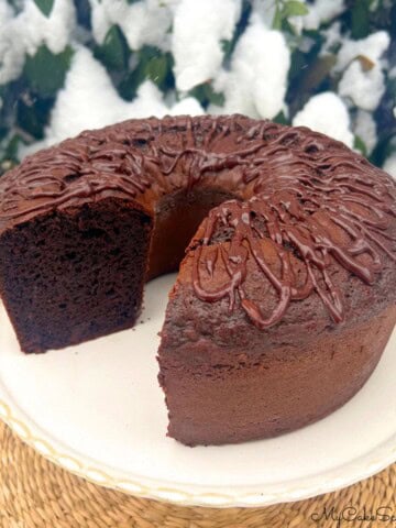 Brownie Bundt Cake, Sliced, on a cake pedestal.