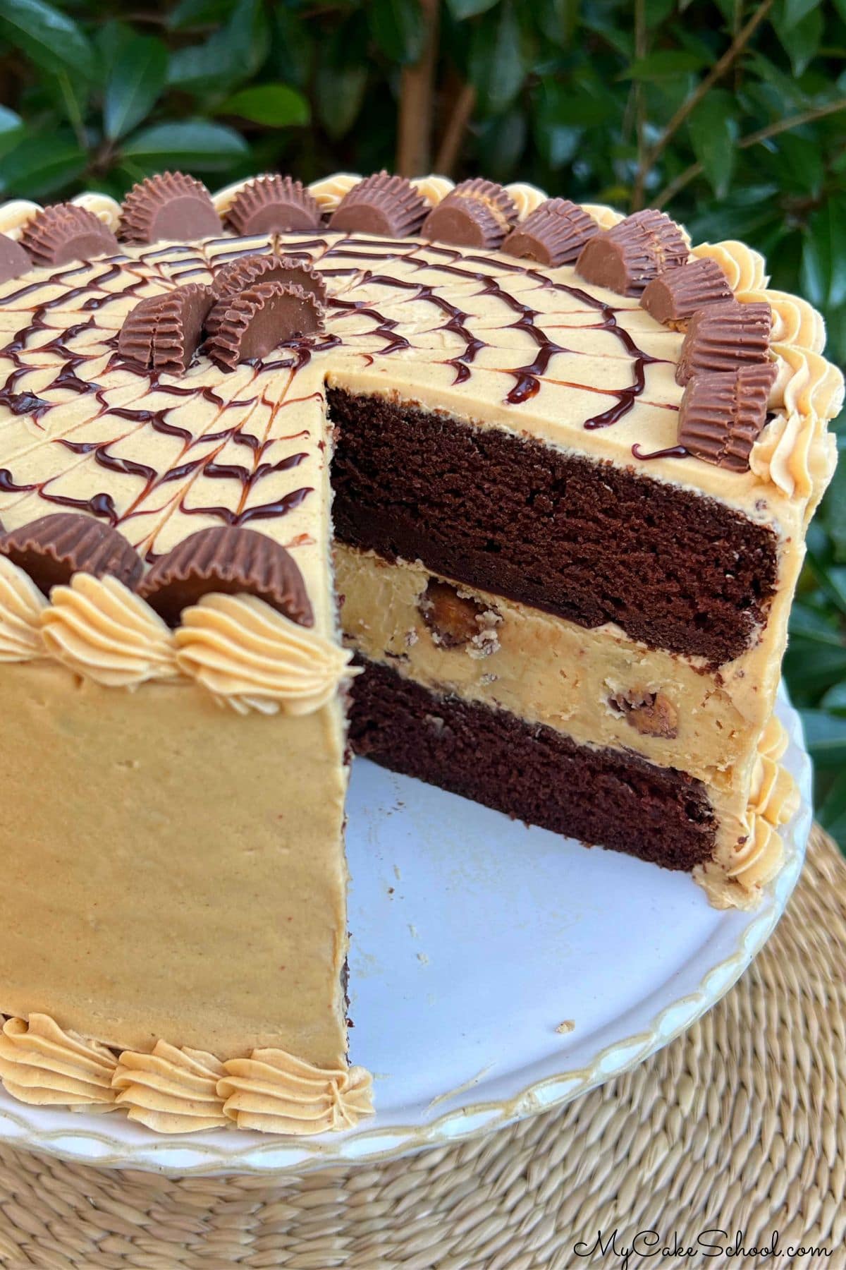 Chocolate Peanut Butter Cheesecake Cake, sliced.