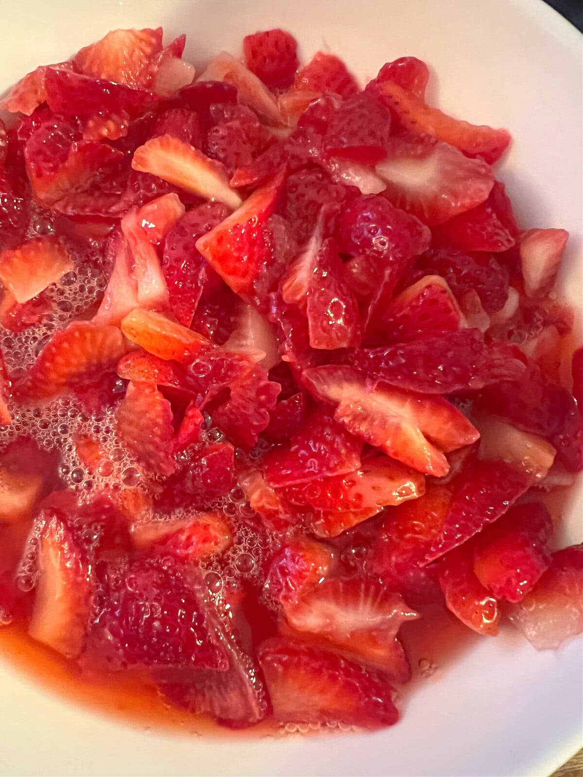 macerated strawberries in a bowl.