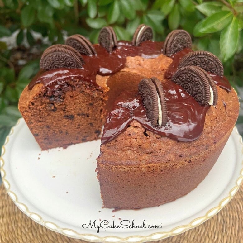 Chocolate Oreo Pound Cake, sliced, on a cake pedestal.