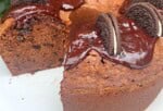 Chocolate Oreo Pound Cake, sliced, on a pedestal.