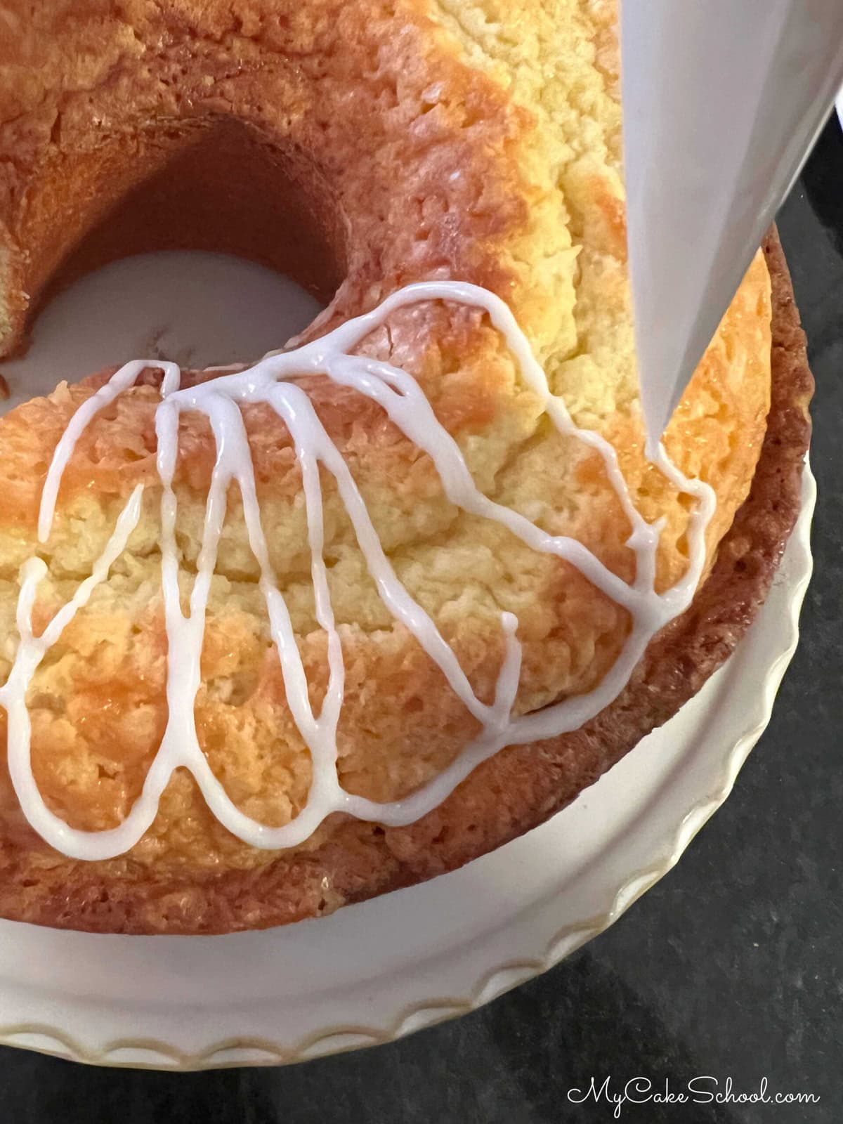 Glazing the Coconut Whipping Cream Pound Cake.