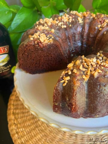 Baileys Chocolate Bundt Cake, sliced, on a pedestal.