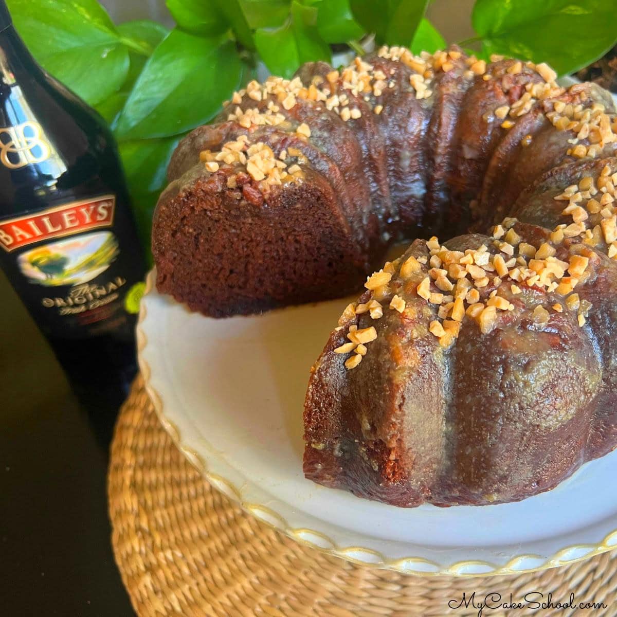 Baileys Chocolate Bundt Cake, sliced, on a pedestal.