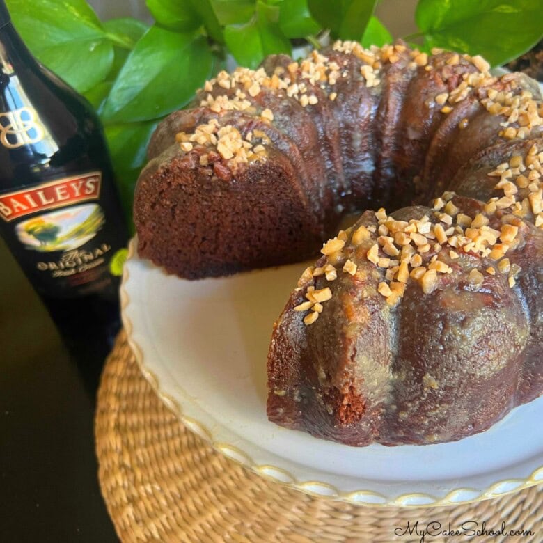 Baileys Irish Cream Chocolate Bundt Cake, sliced, on a cake pedestal.
