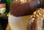 Baileys Chocolate Bundt Cake, sliced, on a pedestal.