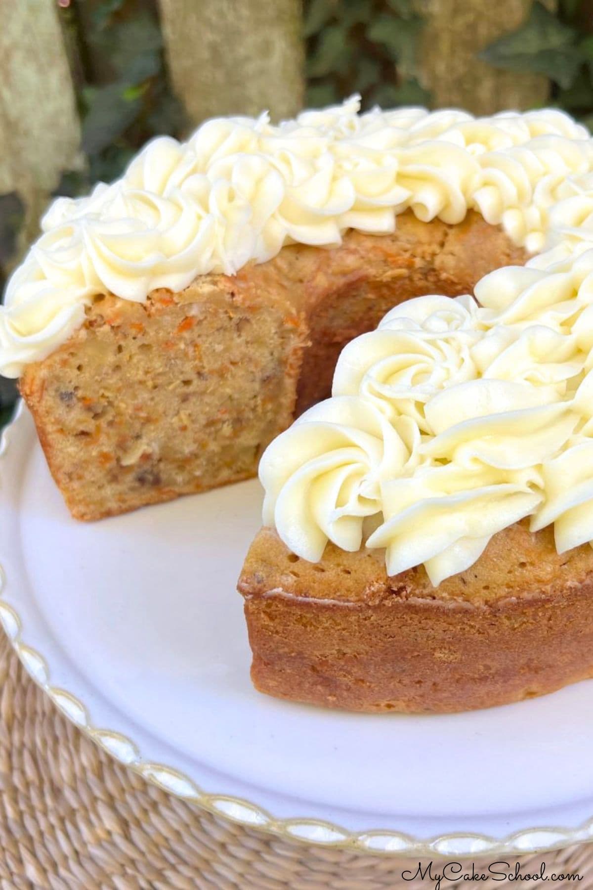 Carrot Pound Cake, sliced, on a pedestal.