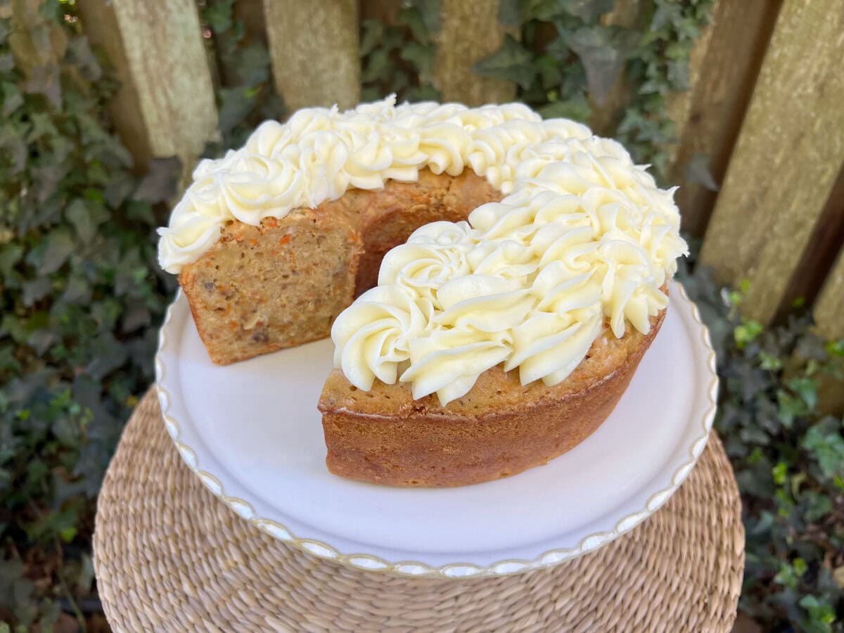 Carrot Pound Cake, sliced, on a pedestal.