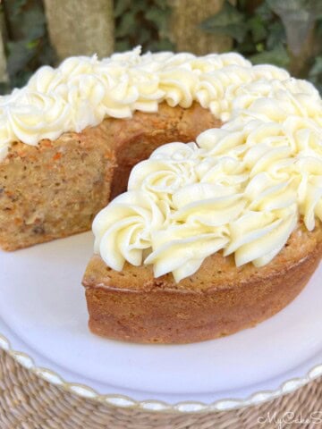 Carrot Pound Cake, sliced, on a pedestal.