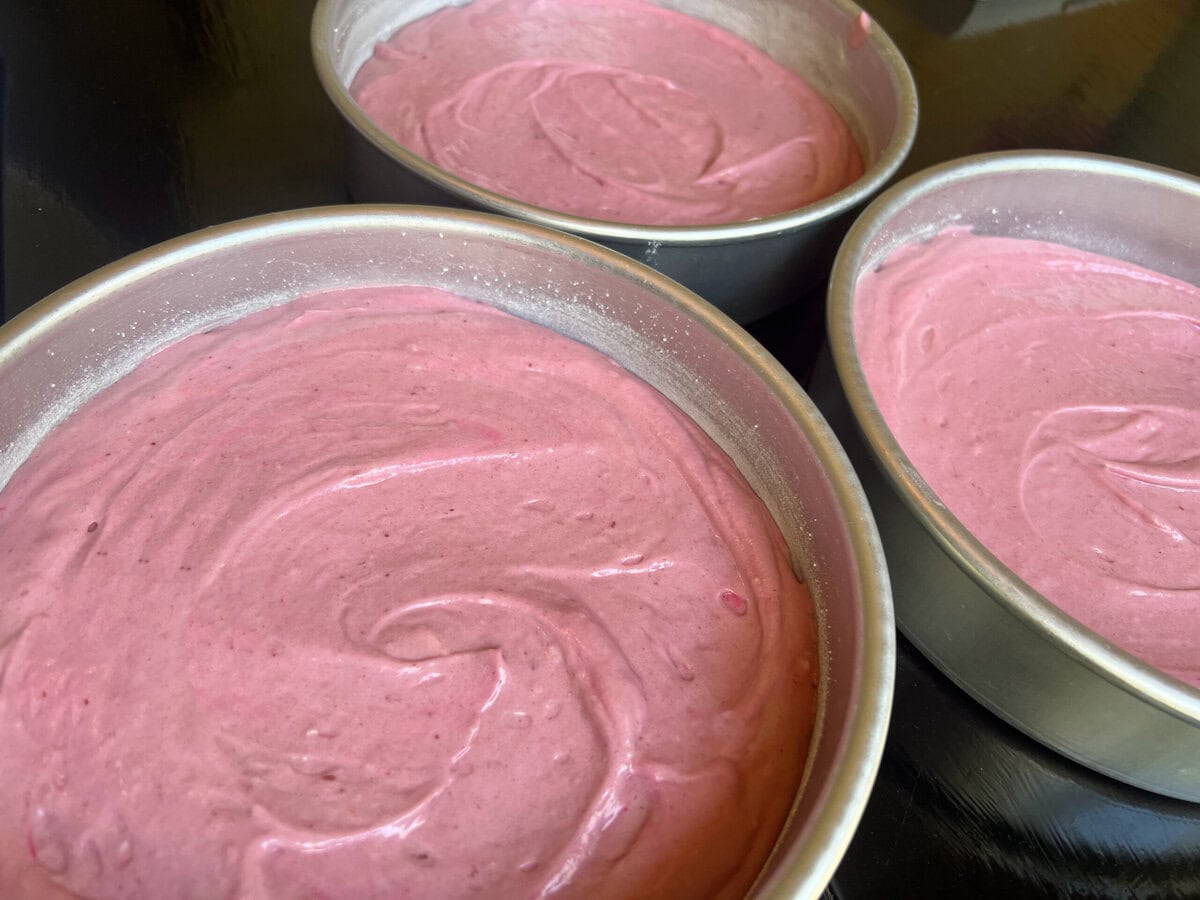 Raspberry Velvet Cake Batter in pans.