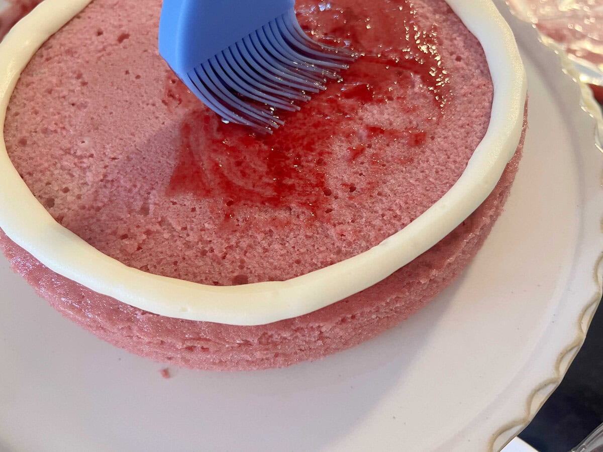 Raspberry Velvet Cake layer, glazed.