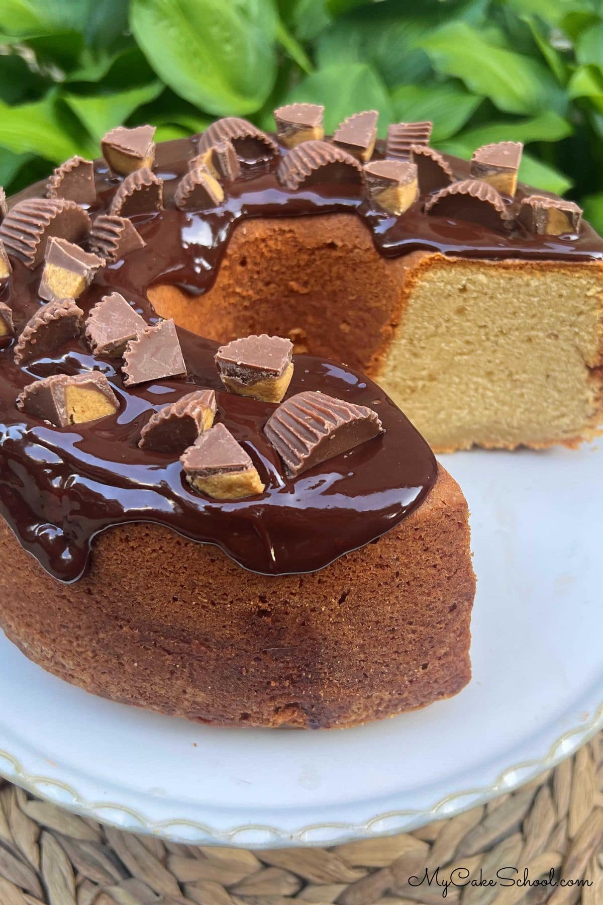 Peanut Butter Pound Cake, sliced, on a pedestal.