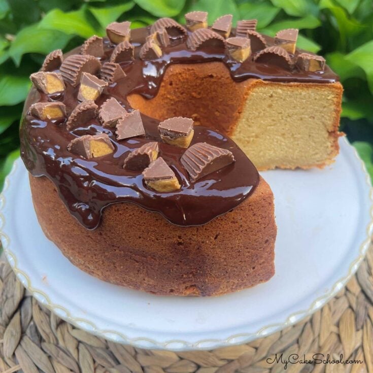 Peanut Butter Pound Cake, sliced, on a cake pedestal.