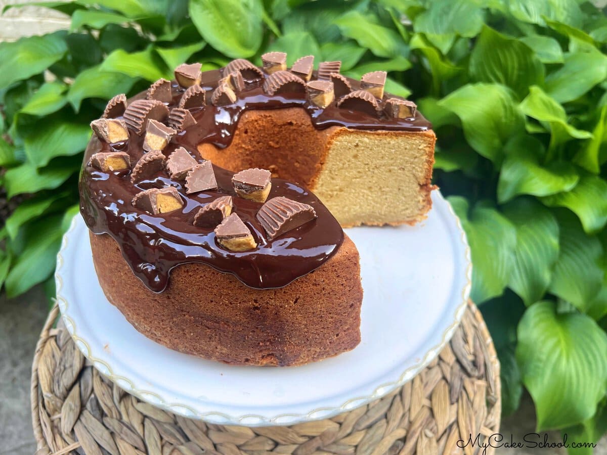 Peanut Butter Pound Cake, sliced, on a pedestal.