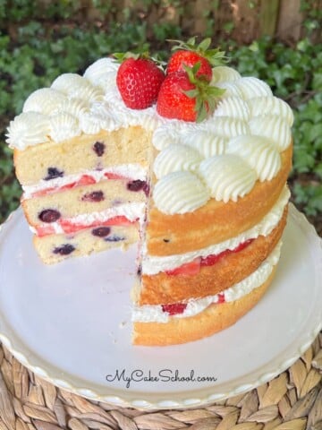Berry Pound Cake on a cake pedestal.