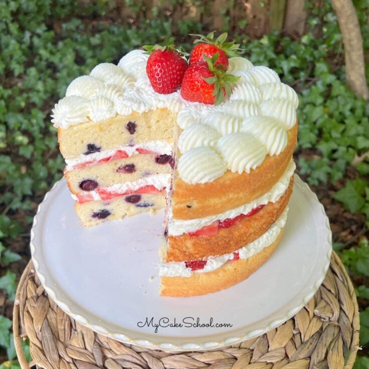 Berry Pound Cake on a cake pedestal.