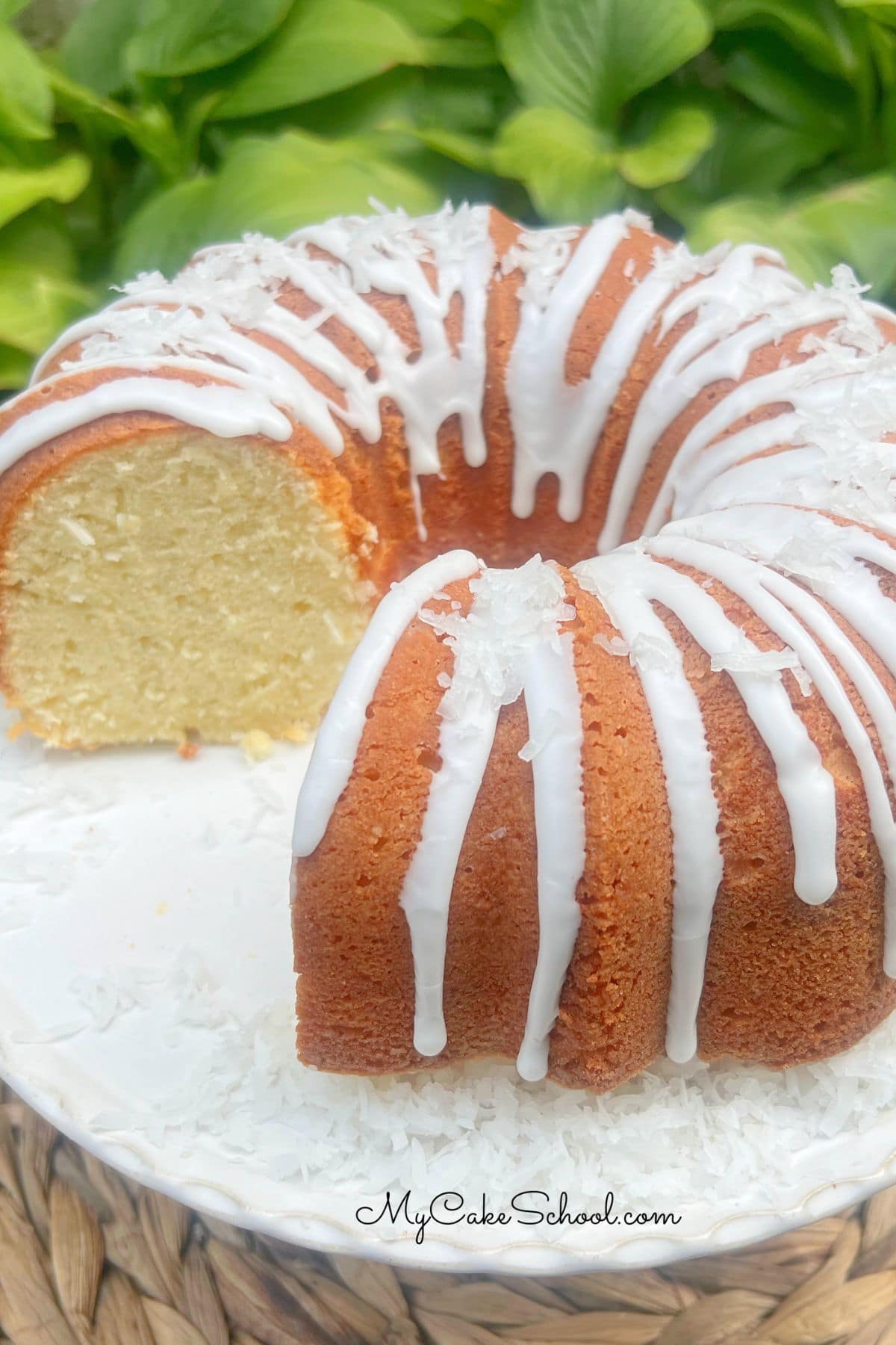 Coconut Mascarpone Pound Cake on a pedestal.