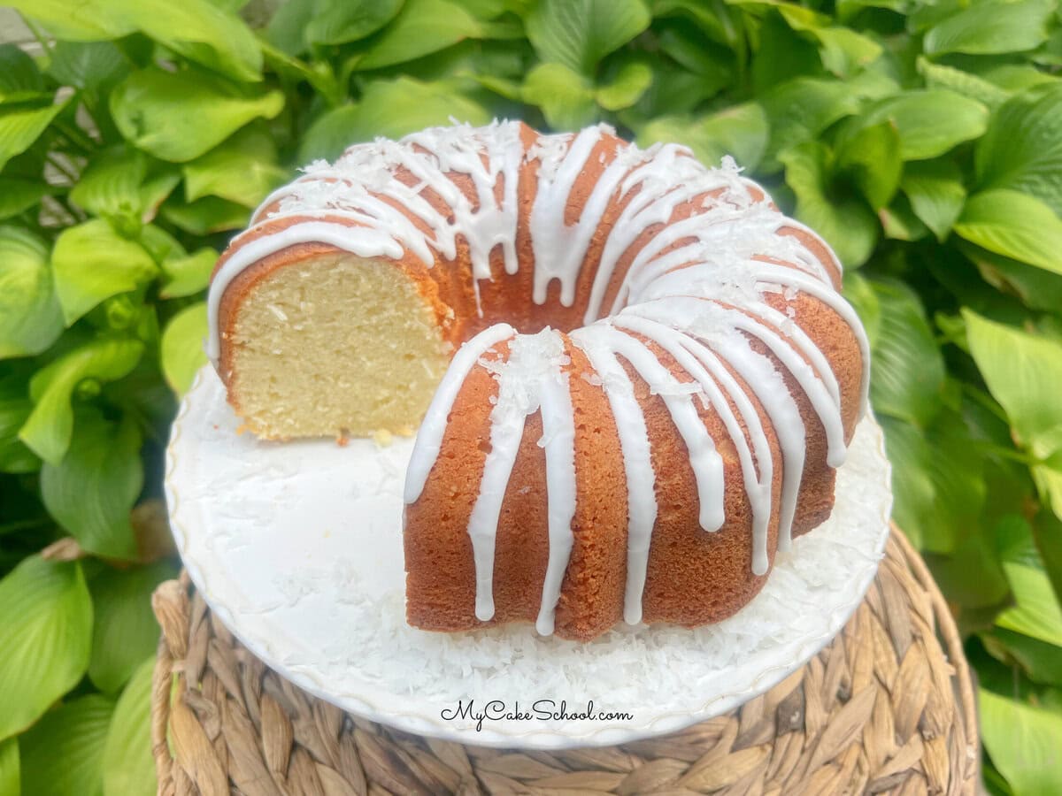Coconut Mascarpone Pound Cake on a pedestal.