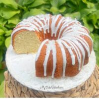 Coconut Mascarpone Pound Cake on a pedestal.