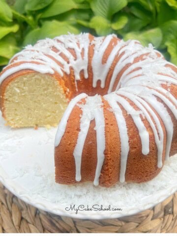 Coconut Mascarpone Pound Cake on a pedestal.