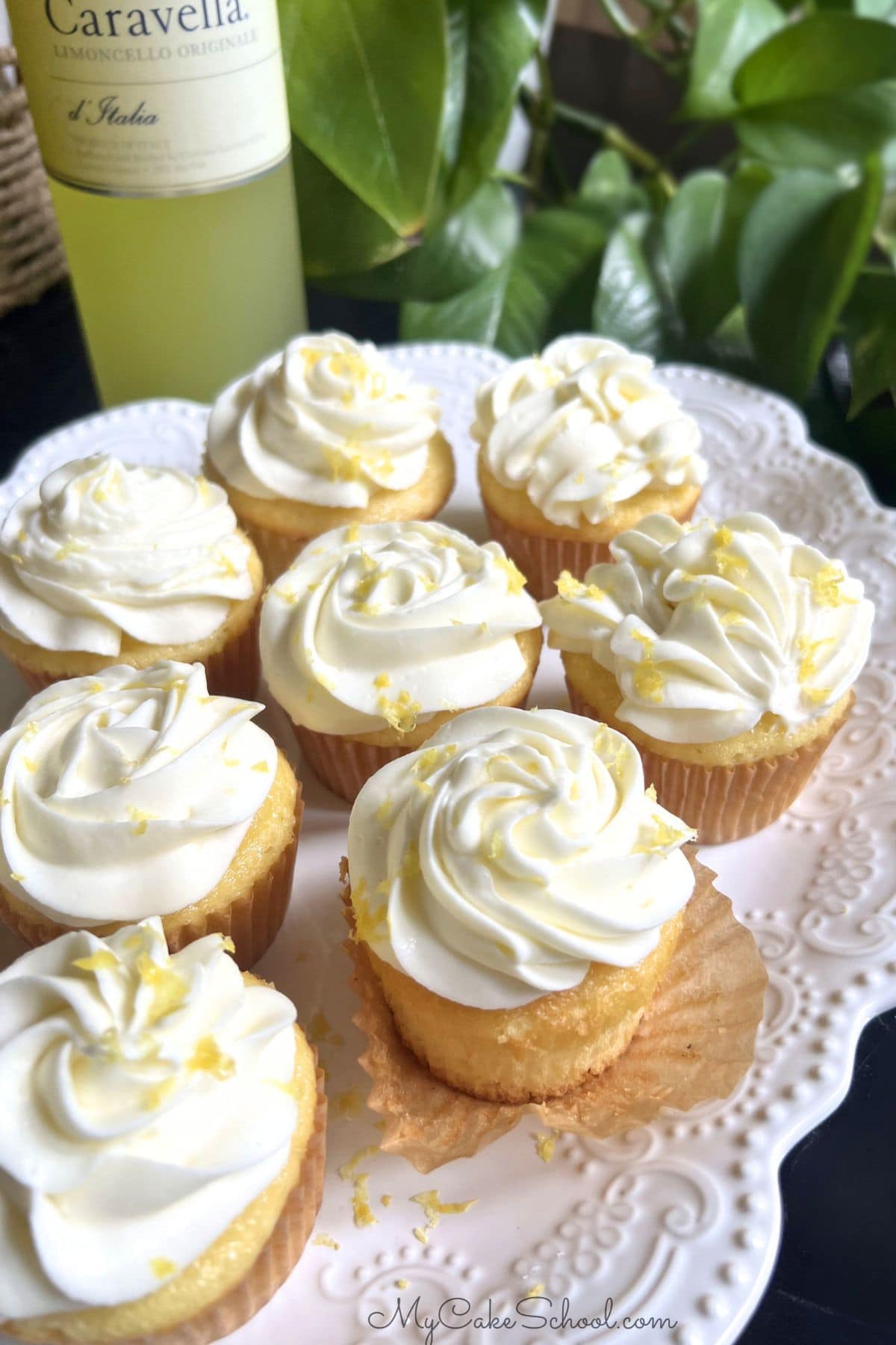 Limoncello Cupcakes from cake mix, placed on a pedestal.